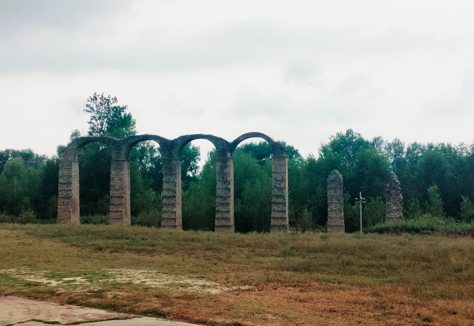 The surviving arches of the Roman aqueduct of Acqui Terme in the Bormida valley