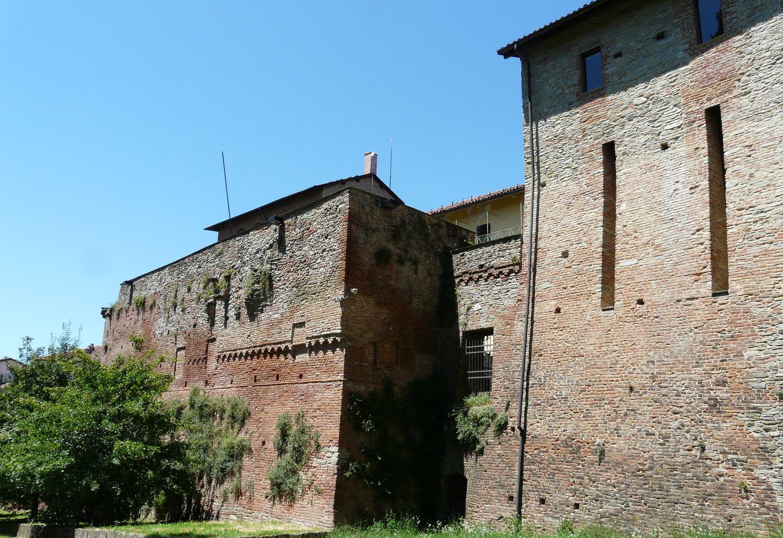 The brick bastion and towers of the Castello dei Paleologi in Acqui Terme