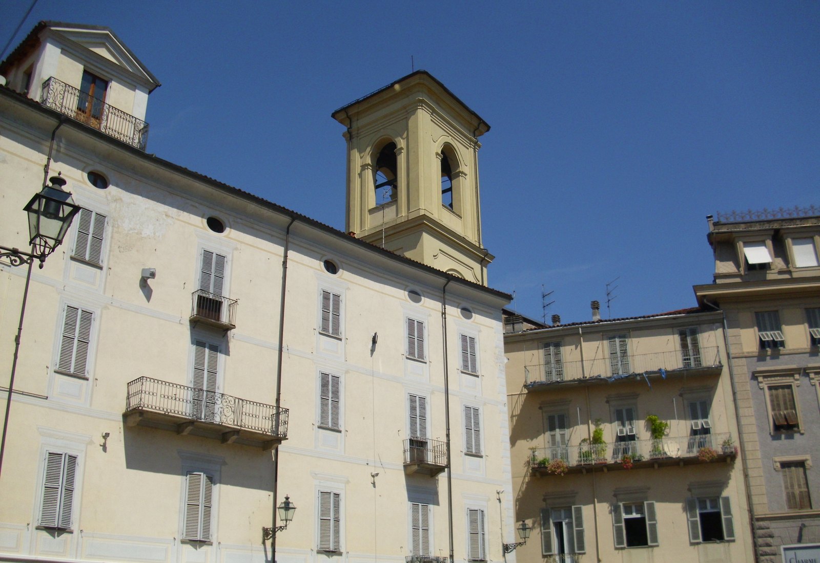 The Torre Civica clock tower rising above the old town of Acqui Terme