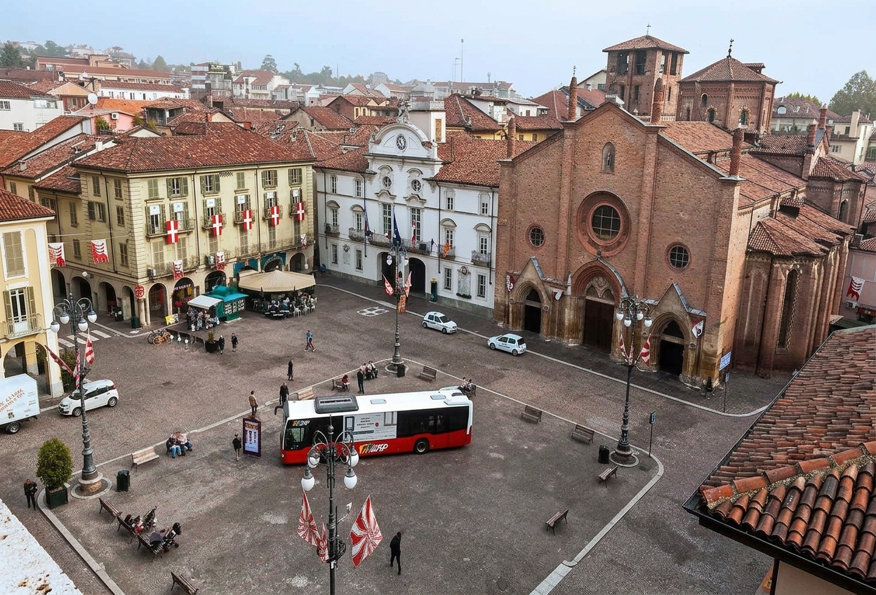 Piazza San Secondo in Asti seen from above, with the Baroque town hall, the brick Collegiata di San Secondo and red-and-white flags