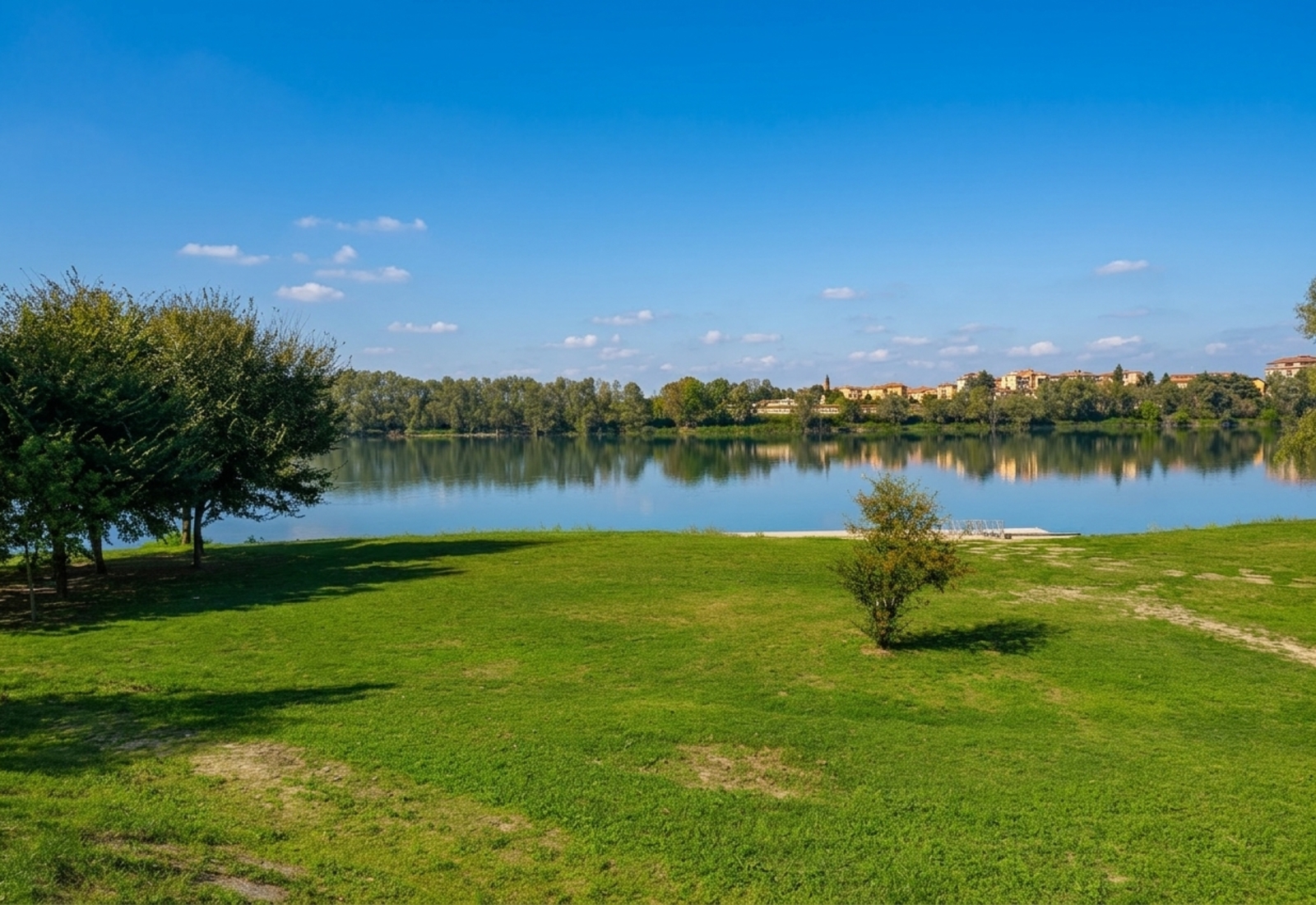 The grassy Po riverfront (Lungo Po) at Casale Monferrato, with the town on the far bank