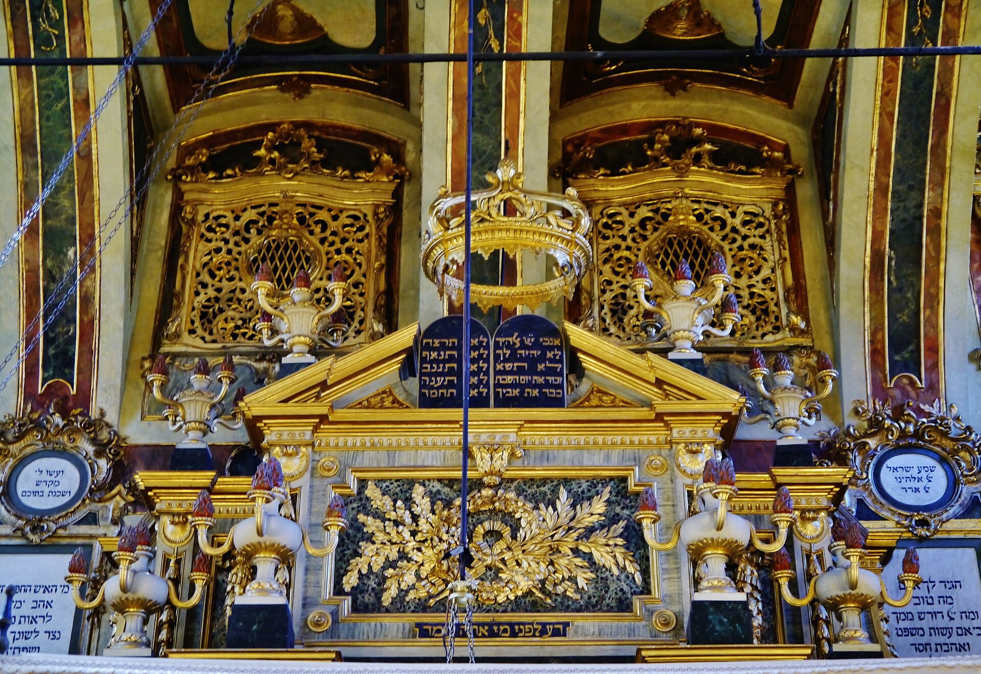 The gilded Baroque Ark of the Torah (Aron ha-Kodesh) inside the Synagogue of Casale Monferrato, with the Ten Commandments tablets above it