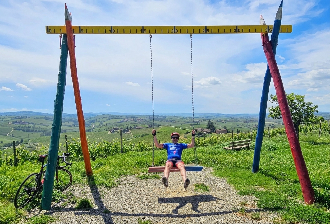 The giant coloured-pencil swing (altalena gigante) above the vineyards of Mombaruzzo