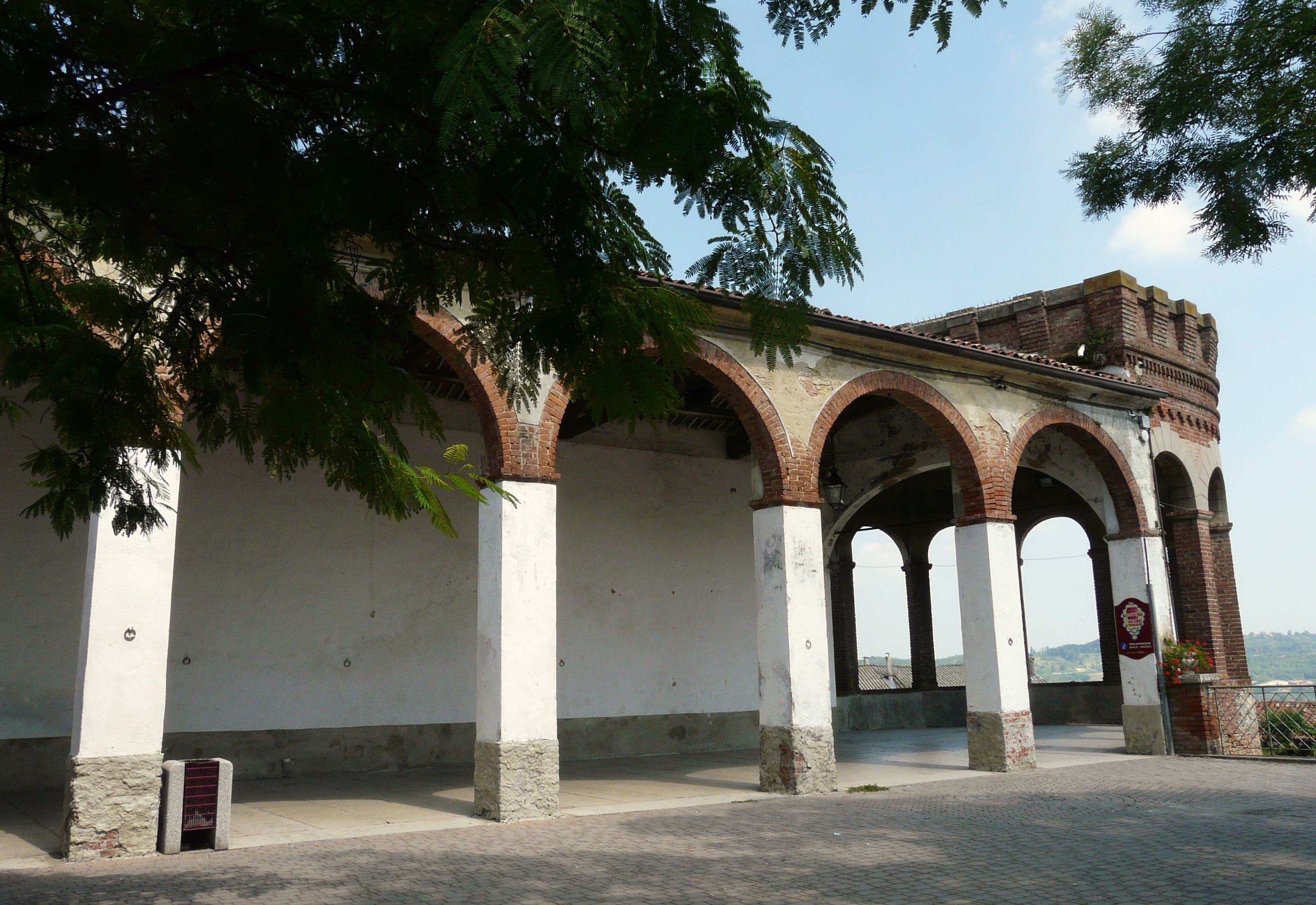 The arcaded loggia and brick tower of the Castello dei Marchesi del Monferrato in Moncalvo