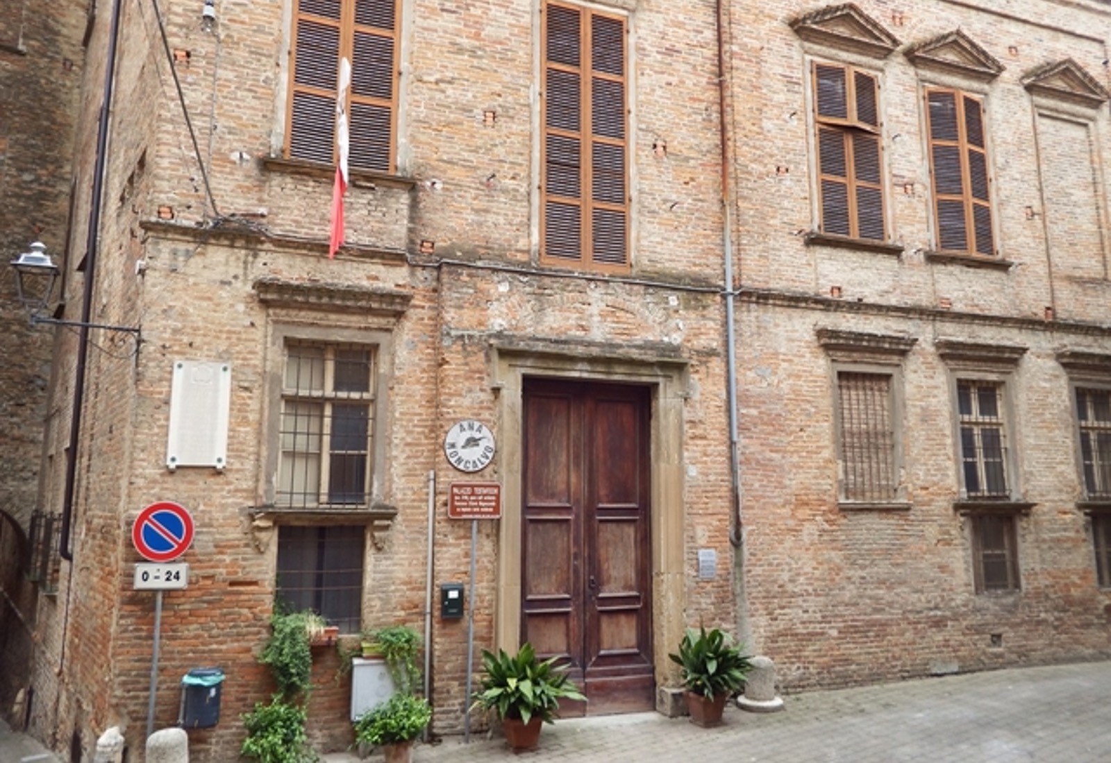 The brick façade and main doorway of Palazzo Testa Fochi in Moncalvo