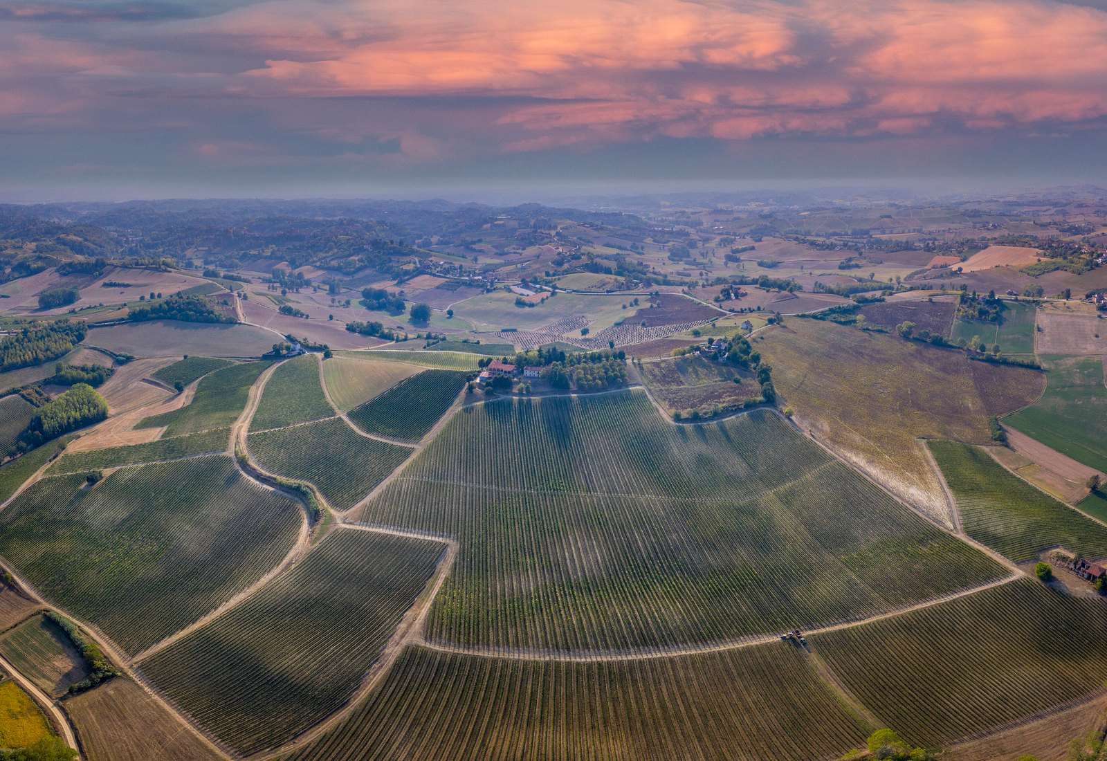 Aerial view at dusk of the amphitheatre of Ruchè vineyards below Castagnole Monferrato